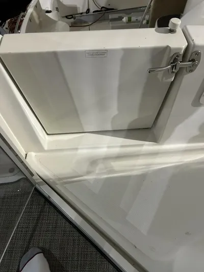 Second Knot Yacht Photos Pics 2003 Carver 396 Aft Cabin MY boat interior, featuring a white compartment with latch.