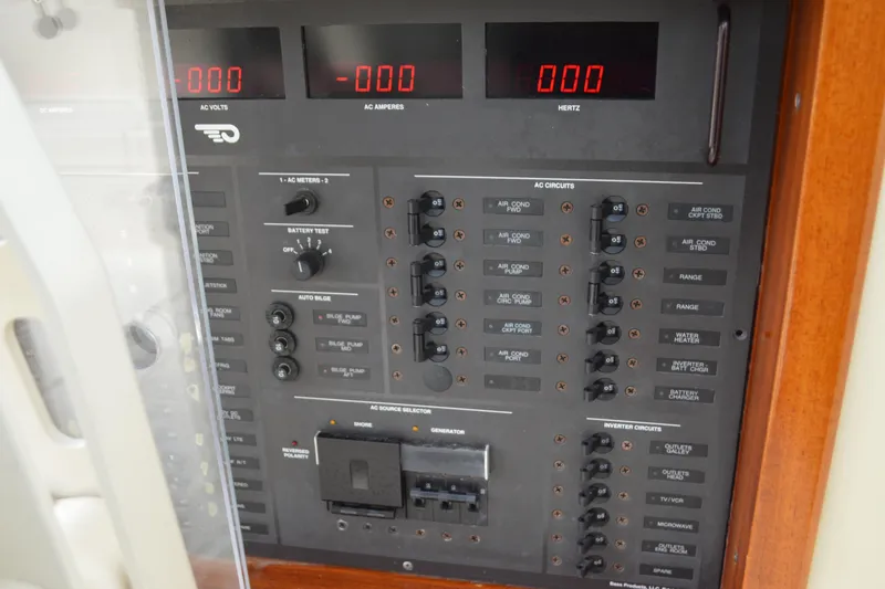 Dragonfly Yacht Photos Pics Electrical control panel on a 2009 Hinckley 37 boat, featuring AC circuits and meters.