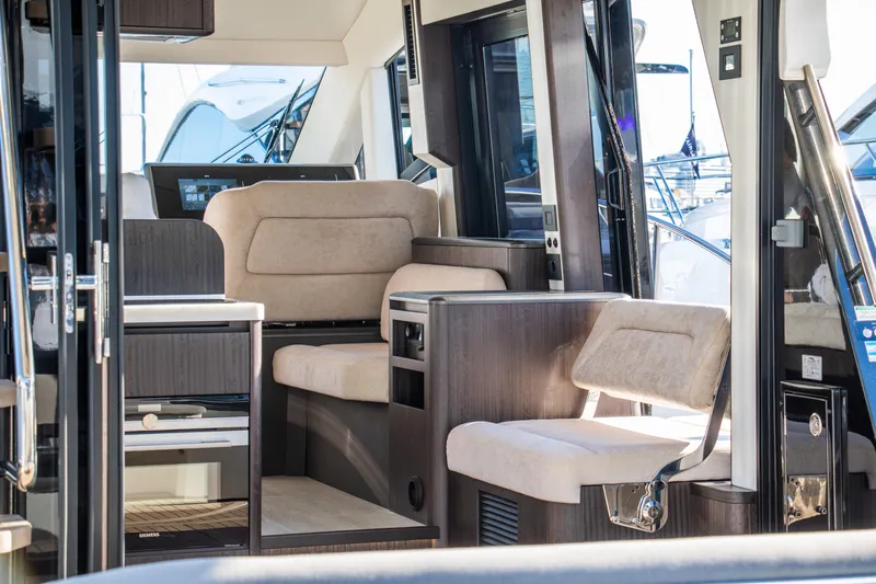  Yacht Photos Pics Interior of 2026 Galeon 480 Fly yacht, featuring modern seating and sleek design.