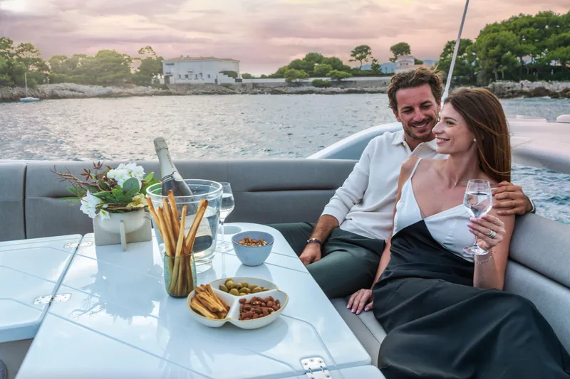  Yacht Photos Pics Couple enjoying a sunset cruise on a 2026 Galeon 480 Fly yacht.