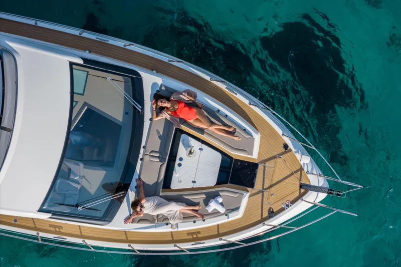  Yacht Photos Pics Aerial view of 2026 Galeon 480 Fly yacht with people relaxing on deck.