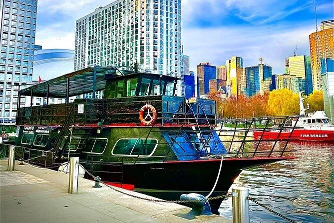 Island Princess Yacht Photos Pics Custom Steel Passenger boat docked in urban harbor, city skyline in background, vibrant colors.