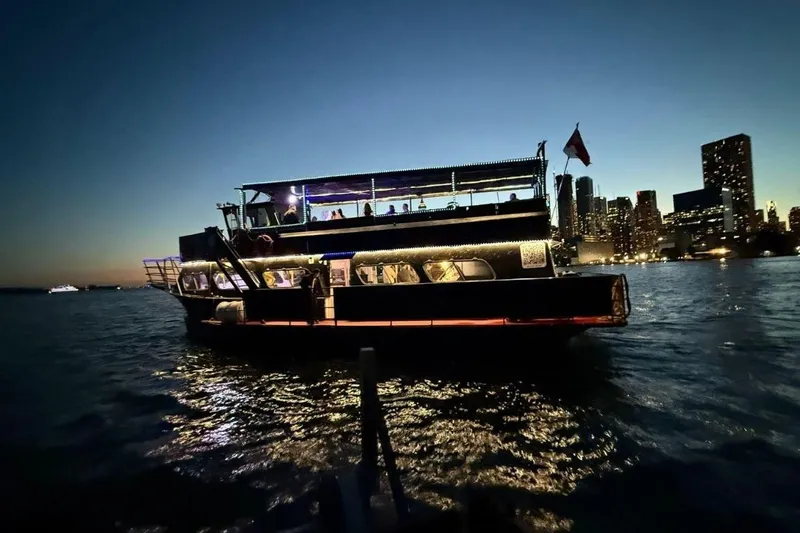 Island Princess Yacht Photos Pics Custom Steel Passenger boat, 120-person capacity, 1983 model, illuminated at night on city waterfront.