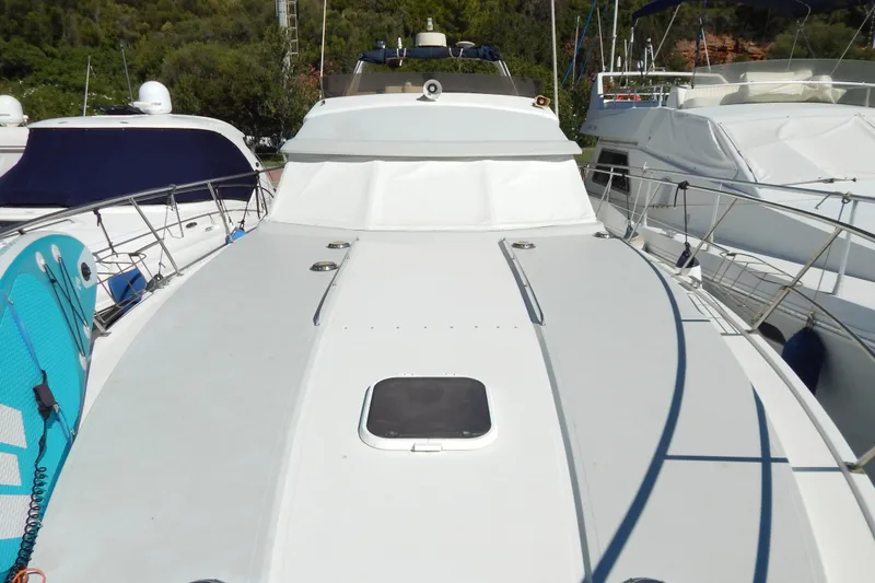  Yacht Photos Pics 1992 Fairline 50 yacht docked, showcasing sleek deck design and modern features.