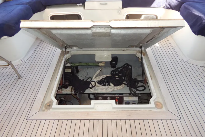  Yacht Photos Pics Open storage compartment on 1992 Fairline 50 yacht deck, containing ropes and equipment.