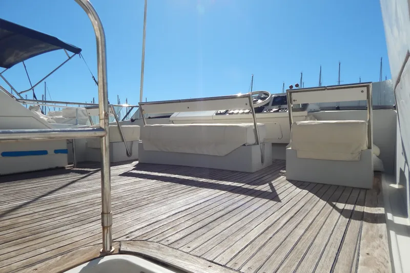  Yacht Photos Pics 1992 Fairline 50 yacht deck with seating and steering, under clear blue sky.