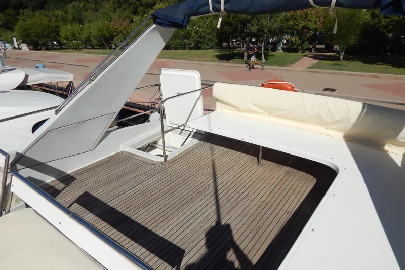 Yacht Photos Pics 1992 Fairline 50 yacht deck with wooden flooring and seating area.