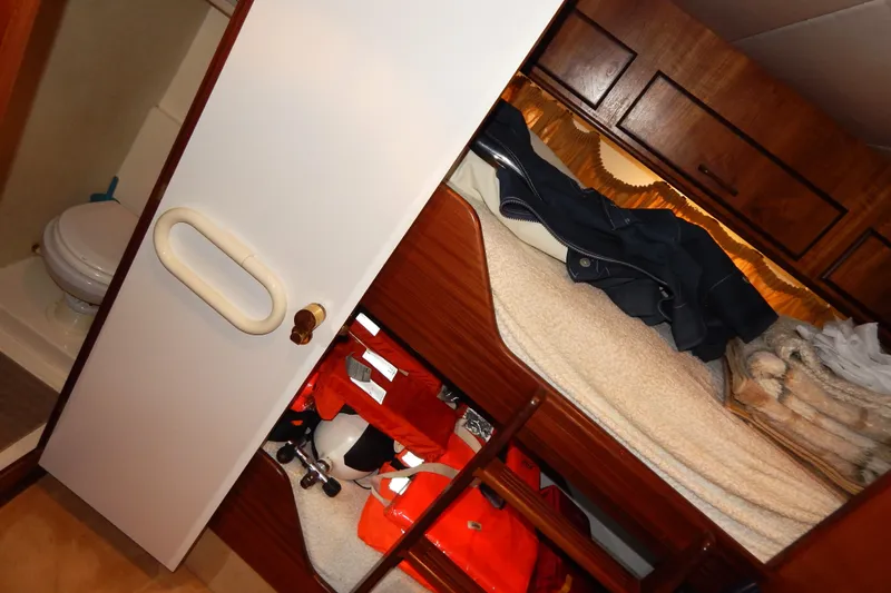  Yacht Photos Pics Interior of 1992 Fairline 50 yacht cabin with bunk beds and life jackets.