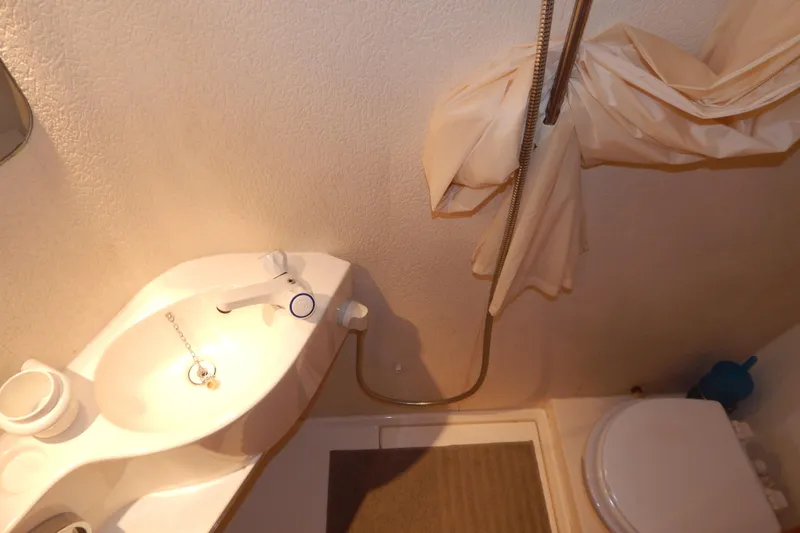  Yacht Photos Pics Bathroom interior of 1992 Fairline 50 yacht, featuring sink and shower area.