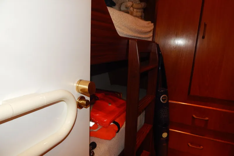  Yacht Photos Pics Interior of 1992 Fairline 50 yacht showing bunk beds and wooden cabinetry.