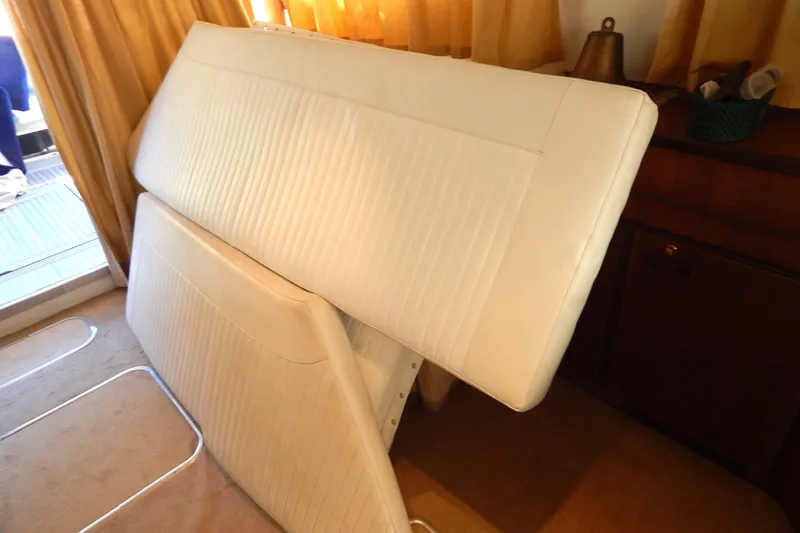  Yacht Photos Pics Interior of 1992 Fairline 50 yacht with white cushioned seating.