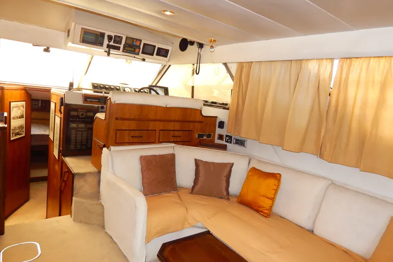  Yacht Photos Pics Interior of 1992 Fairline 50 yacht with cozy seating and navigation area.