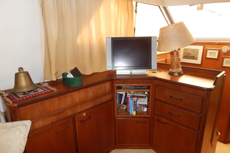 Yacht Photos Pics Cozy 1992 Fairline 50 yacht interior with TV, lamp, and bookshelf.