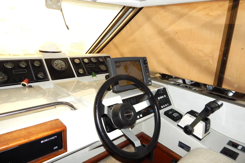  Yacht Photos Pics Cockpit of 1992 Fairline 50 yacht with steering wheel and navigation instruments.