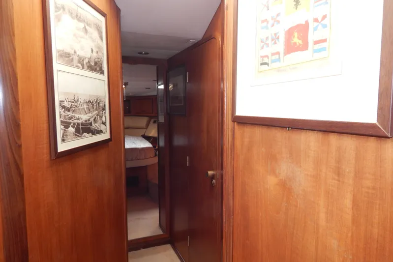  Yacht Photos Pics Interior hallway of 1992 Fairline 50 yacht with framed nautical artwork.