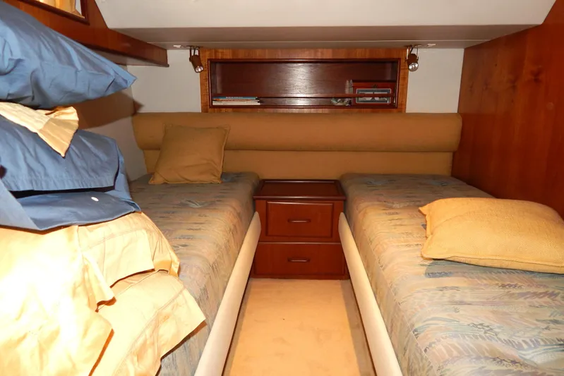  Yacht Photos Pics Twin cabin interior of 1992 Fairline 50 yacht with wooden accents and cozy bedding.