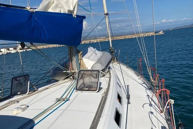  Yacht Photos Pics 2007 Beneteau Cyclades 50 sailboat on calm blue waters, clear sky.