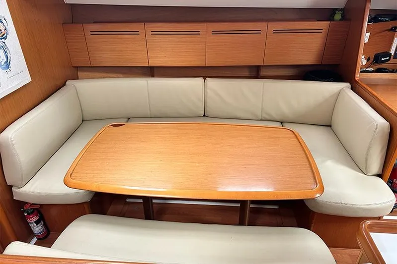  Yacht Photos Pics Interior of 2007 Beneteau Cyclades 50 yacht with cozy seating and wooden table.