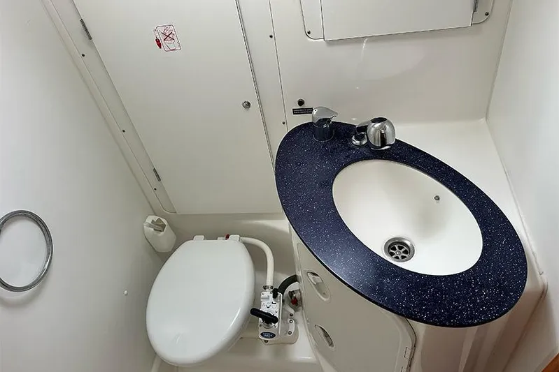  Yacht Photos Pics Bathroom interior of 2007 Beneteau Cyclades 50 yacht with sink and toilet.