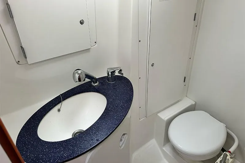  Yacht Photos Pics Bathroom interior of 2007 Beneteau Cyclades 50 yacht with sink and toilet.