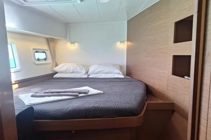 Total Eclipse Yacht Photos Pics Cozy bedroom in 2018 Lagoon 42 yacht with modern design and natural light.