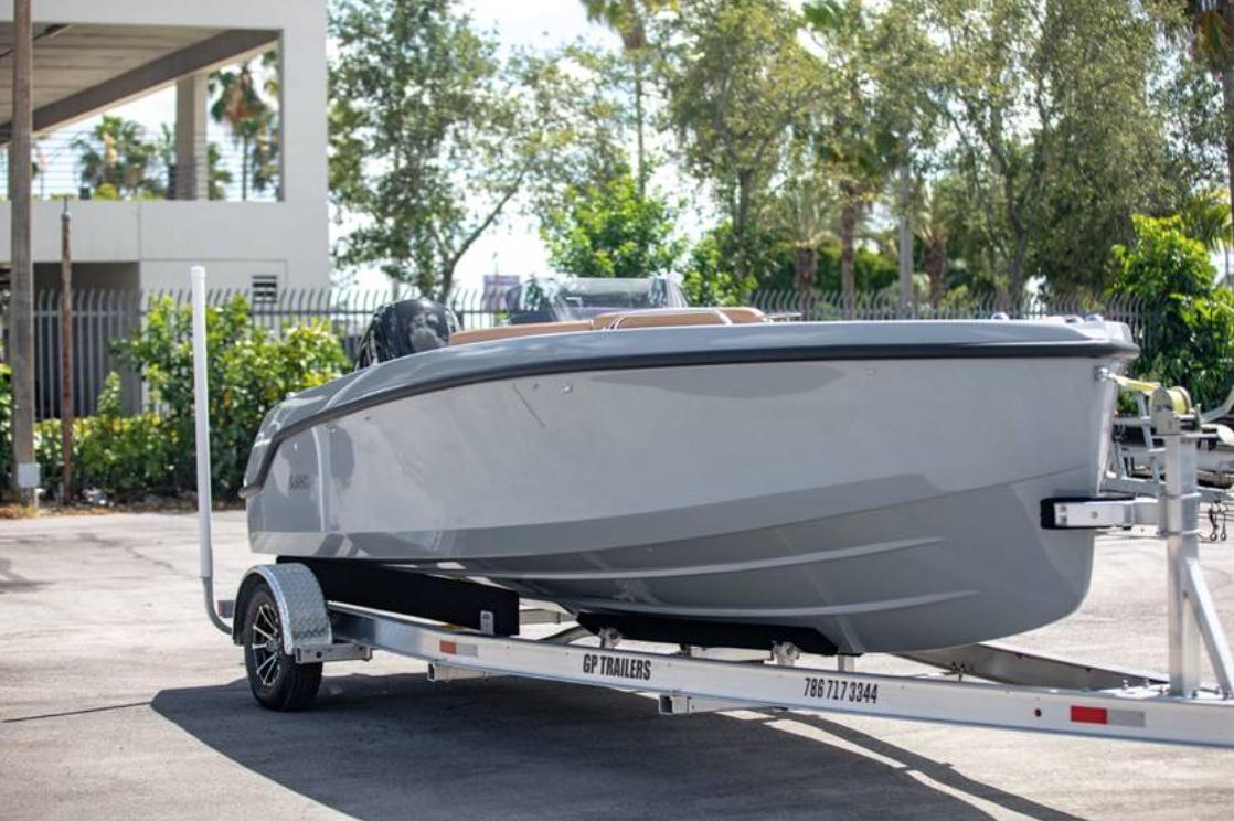 2022 Rand BREEZE boat on a trailer in a parking lot.