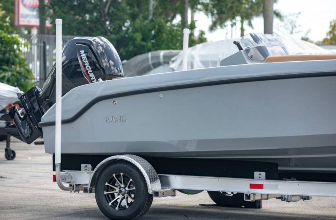 2022 Rand BREEZE boat on trailer with Mercury outboard motor.