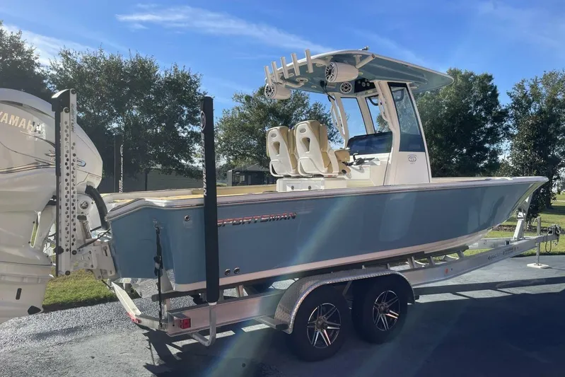  Yacht Photos Pics 2023 Sportsman Masters 267 Bay Boat on trailer, featuring Yamaha engine, under clear blue sky.