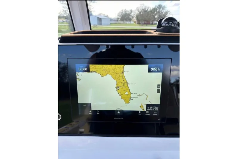  Yacht Photos Pics 2023 Sportsman Masters 267 Bay Boat GPS display showing Florida map on Garmin screen.