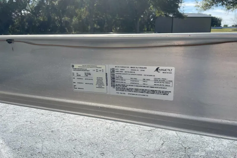  Yacht Photos Pics 2023 Sportsman Masters 267 Bay Boat trailer label with specifications and tire information.