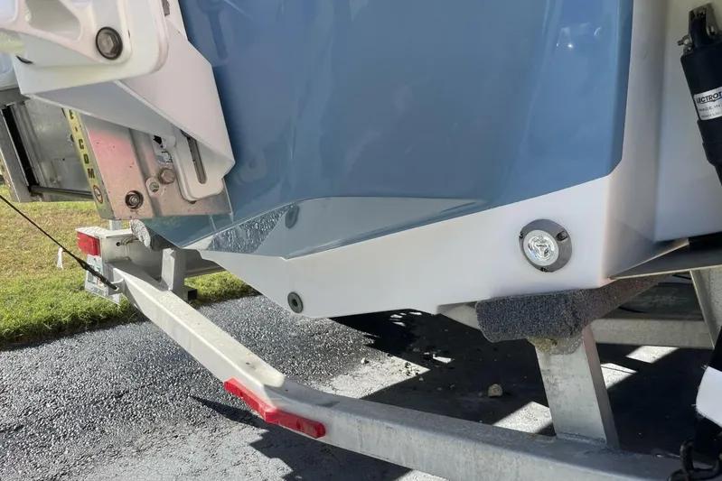  Yacht Photos Pics 2023 Sportsman Masters 267 Bay Boat on trailer, close-up of hull and fittings.