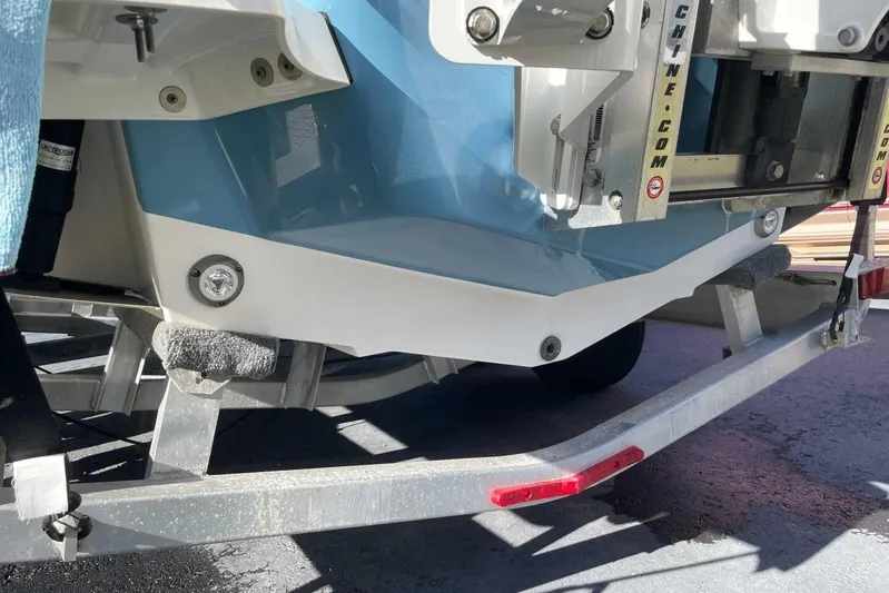  Yacht Photos Pics 2023 Sportsman Masters 267 Bay Boat on trailer, showcasing hull and transom details.