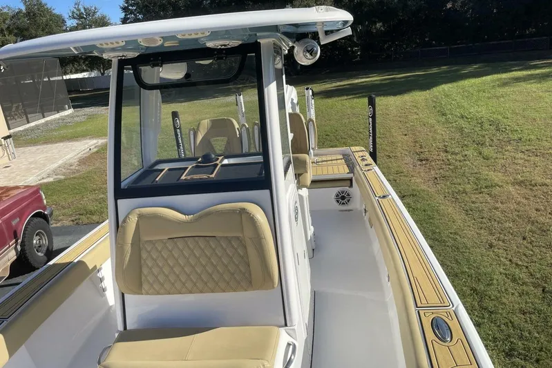  Yacht Photos Pics 2023 Sportsman Masters 267 Bay Boat with tan seating and sleek design.