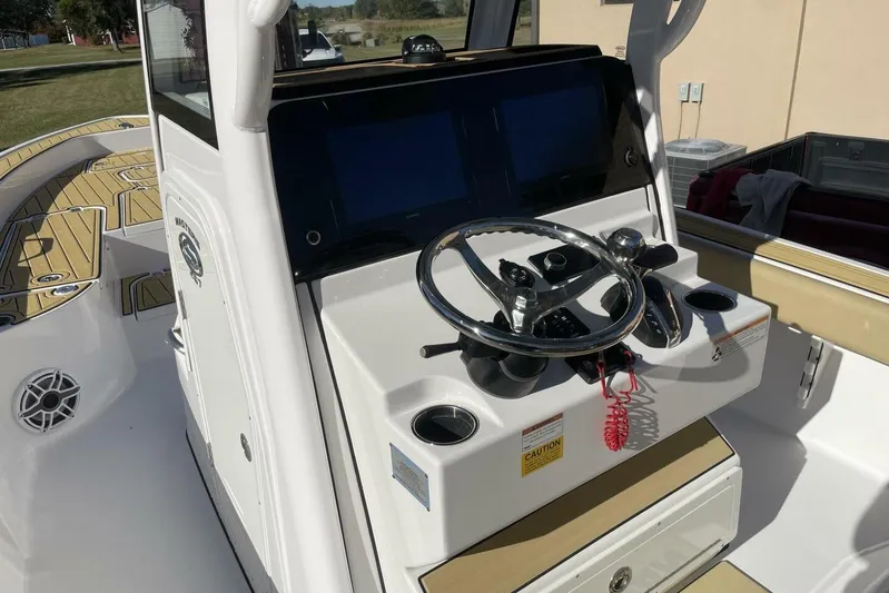  Yacht Photos Pics 2023 Sportsman Masters 267 Bay Boat helm with steering wheel and dual screens.
