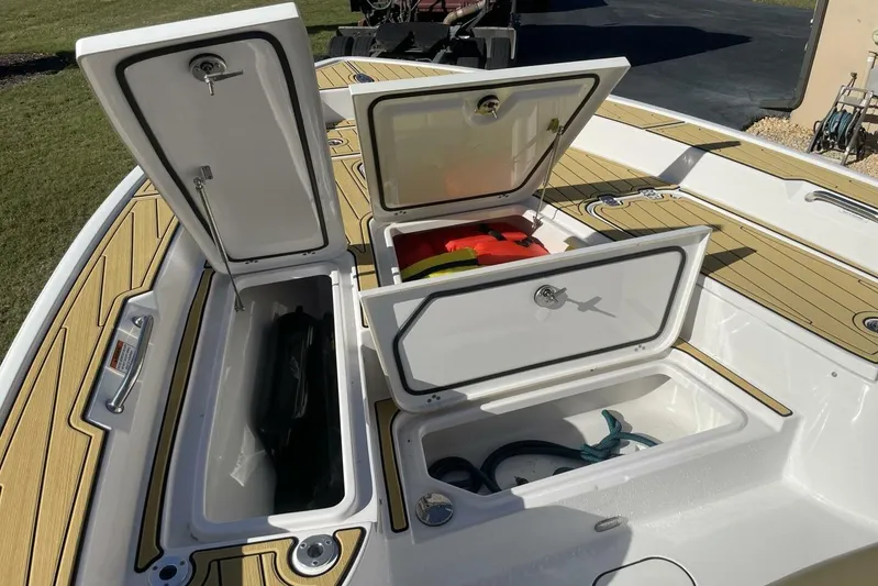  Yacht Photos Pics 2023 Sportsman Masters 267 Bay Boat storage compartments open, showcasing interior space.