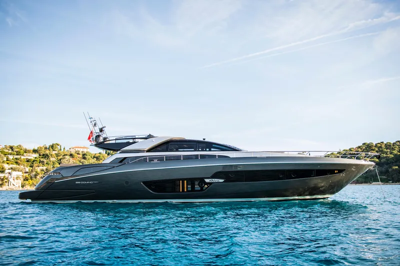  Yacht Photos Pics Luxury 2019 Riva 88 Domino Super yacht cruising on clear blue waters.