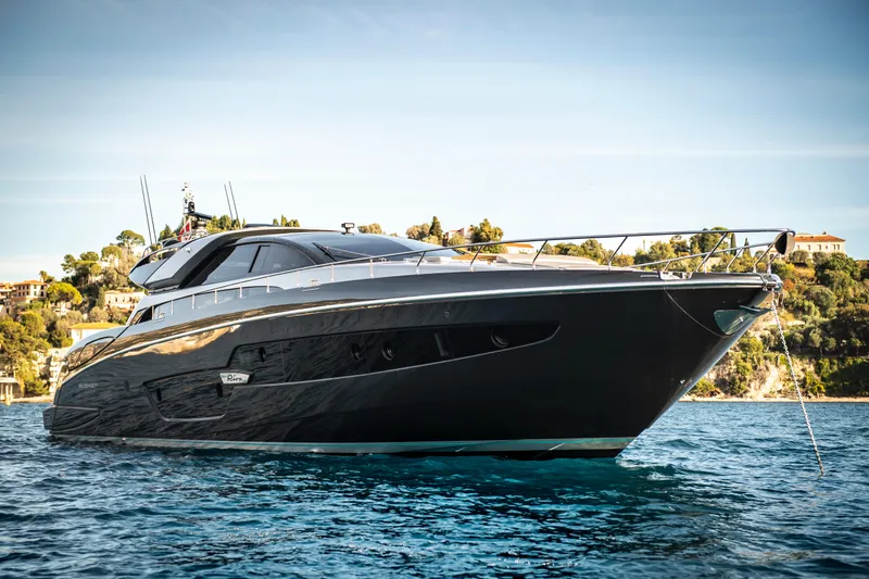  Yacht Photos Pics Luxury 2019 Riva 88 Domino Super yacht on serene blue water.