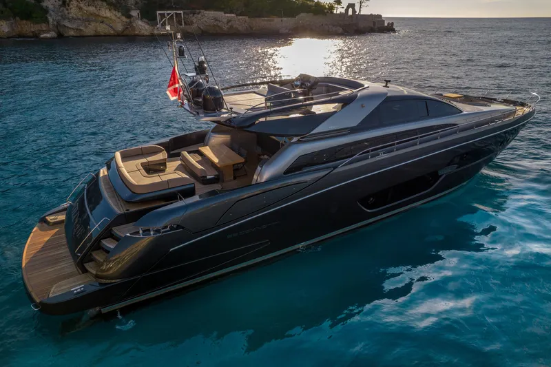 Yacht Photos Pics Luxurious 2019 Riva 88 Domino Super yacht on serene blue waters at sunset.