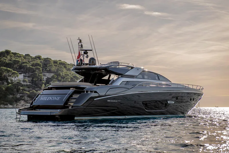  Yacht Photos Pics 2019 Riva 88 Domino Super yacht on serene water at sunset.