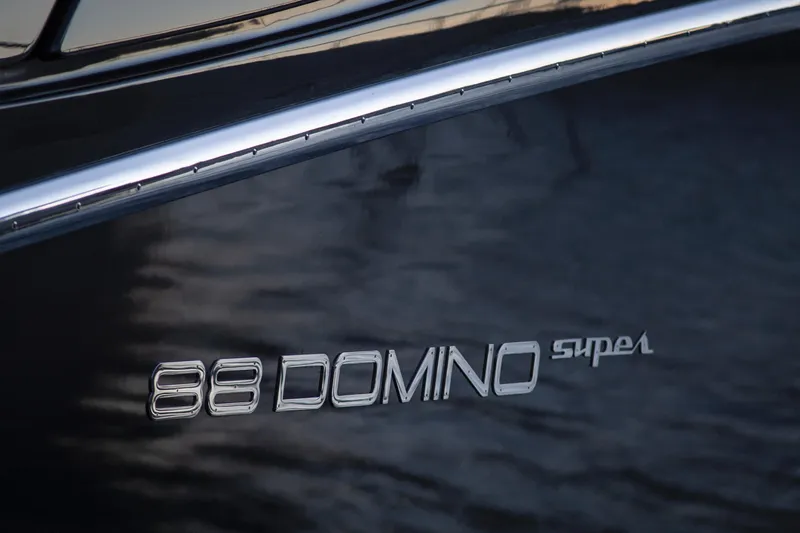  Yacht Photos Pics 2019 Riva 88 Domino Super yacht logo on sleek, reflective surface.