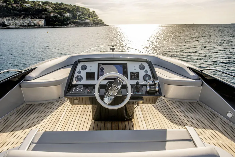  Yacht Photos Pics Cockpit view of 2019 Riva 88 Domino Super yacht at sea, sunset in background.