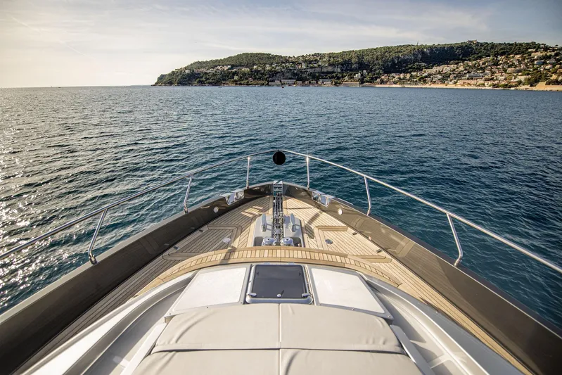  Yacht Photos Pics Bow view of 2019 Riva 88 Domino Super yacht cruising near scenic coastline.