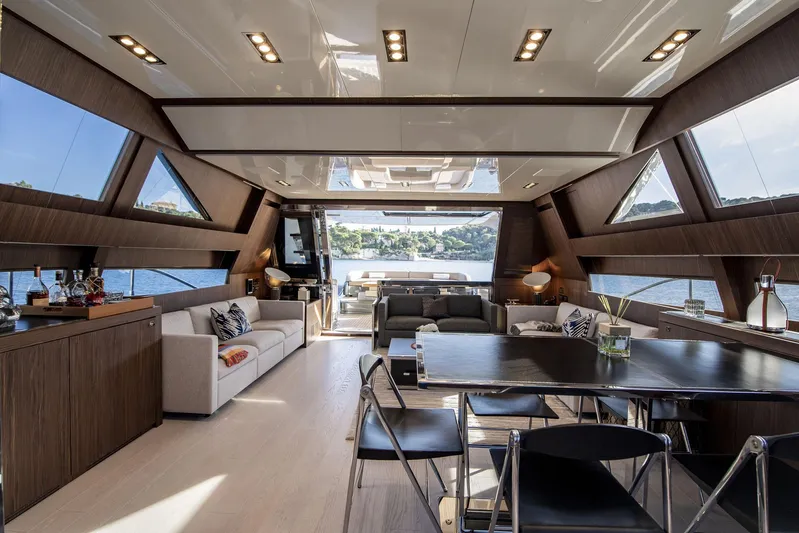  Yacht Photos Pics Luxurious interior of 2019 Riva 88 Domino Super yacht with modern furnishings and panoramic windows.