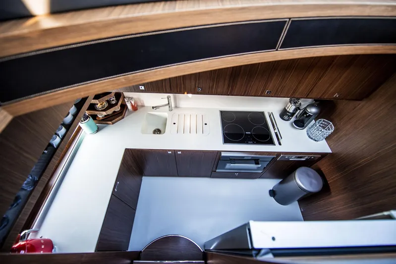  Yacht Photos Pics Luxurious kitchen interior of 2019 Riva 88 Domino Super yacht with modern appliances.