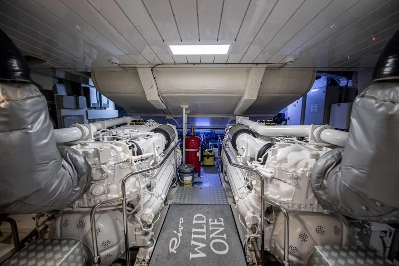  Yacht Photos Pics Engine room of 2019 Riva 88 Domino Super yacht, featuring dual engines and "Wild One" mat.