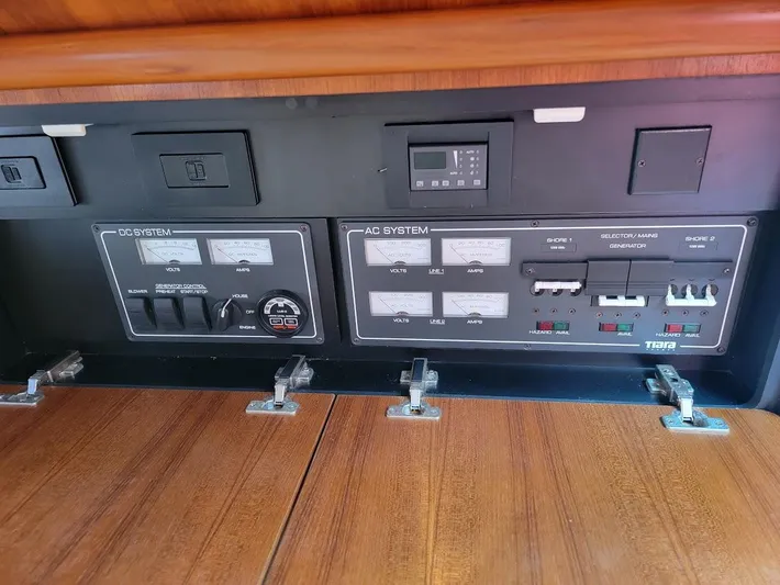  Yacht Photos Pics Electrical control panel of a 2006 Tiara Yachts 3200 Open, featuring AC and DC systems.