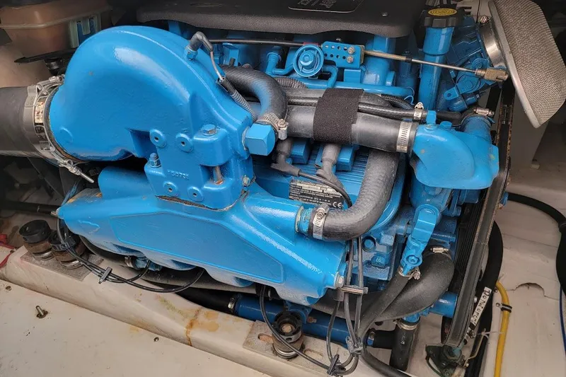  Yacht Photos Pics Engine of a 2006 Tiara Yachts 3200 Open, featuring blue components and hoses.