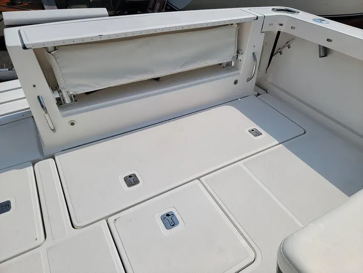  Yacht Photos Pics 2006 Tiara Yachts 3200 Open deck with storage compartments and seating area.