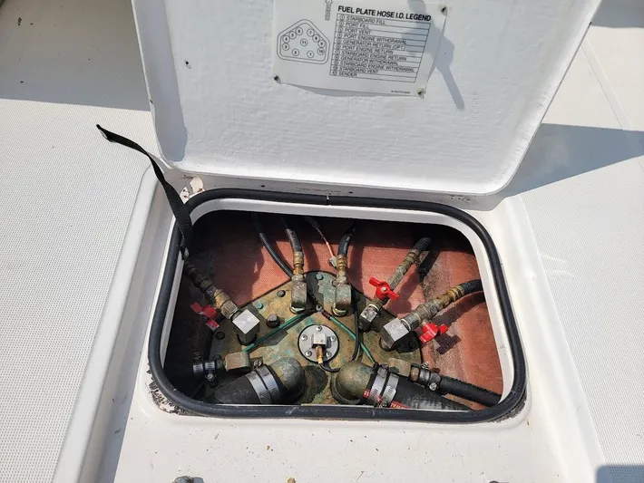  Yacht Photos Pics Fuel hose connections in a 2006 Tiara Yachts 3200 Open, with labeled access panel.