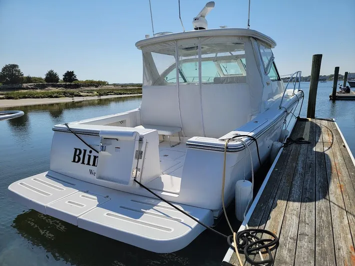  Yacht Photos Pics 2006 Tiara Yachts 3200 Open docked, rear view, sunny day, calm water.